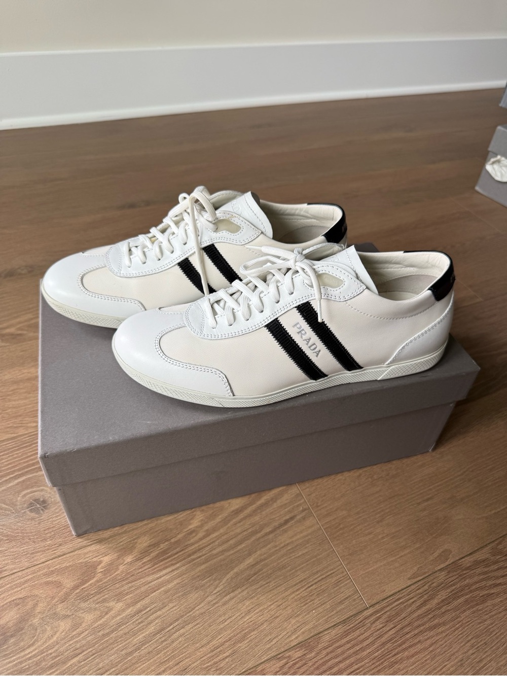 Prada White Leather Low-Top Sneakers with Black Stripes